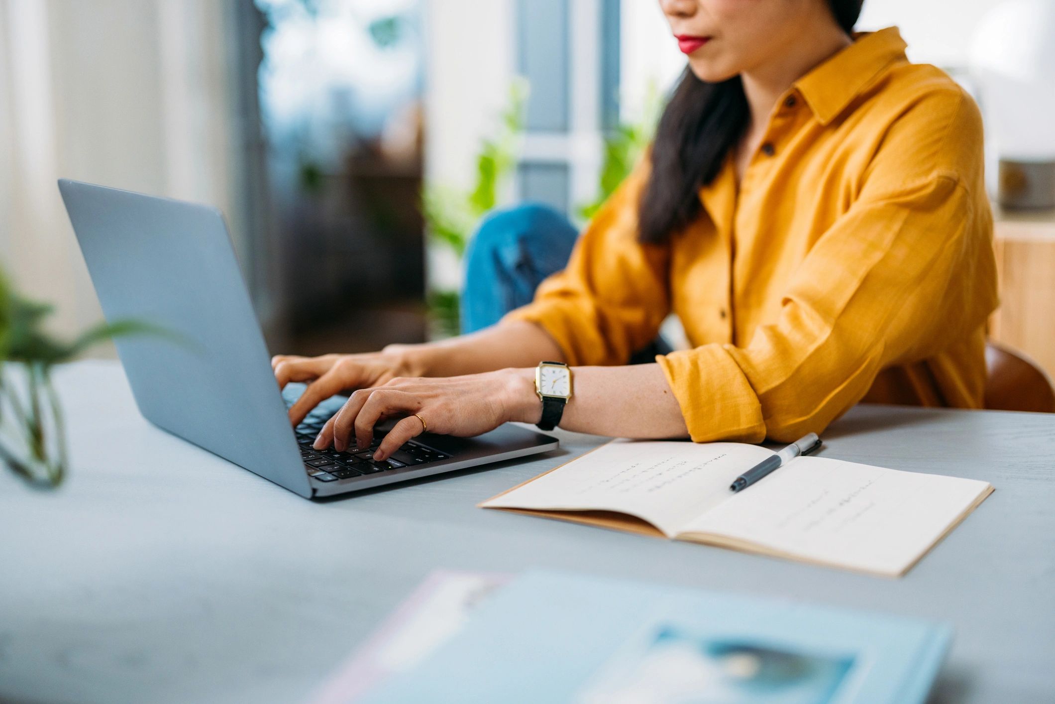 Author working on a laptop at a desk