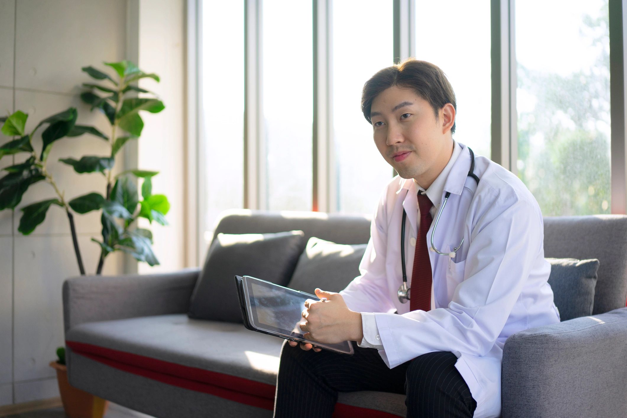 Nursing professional reviewing notes at a desk