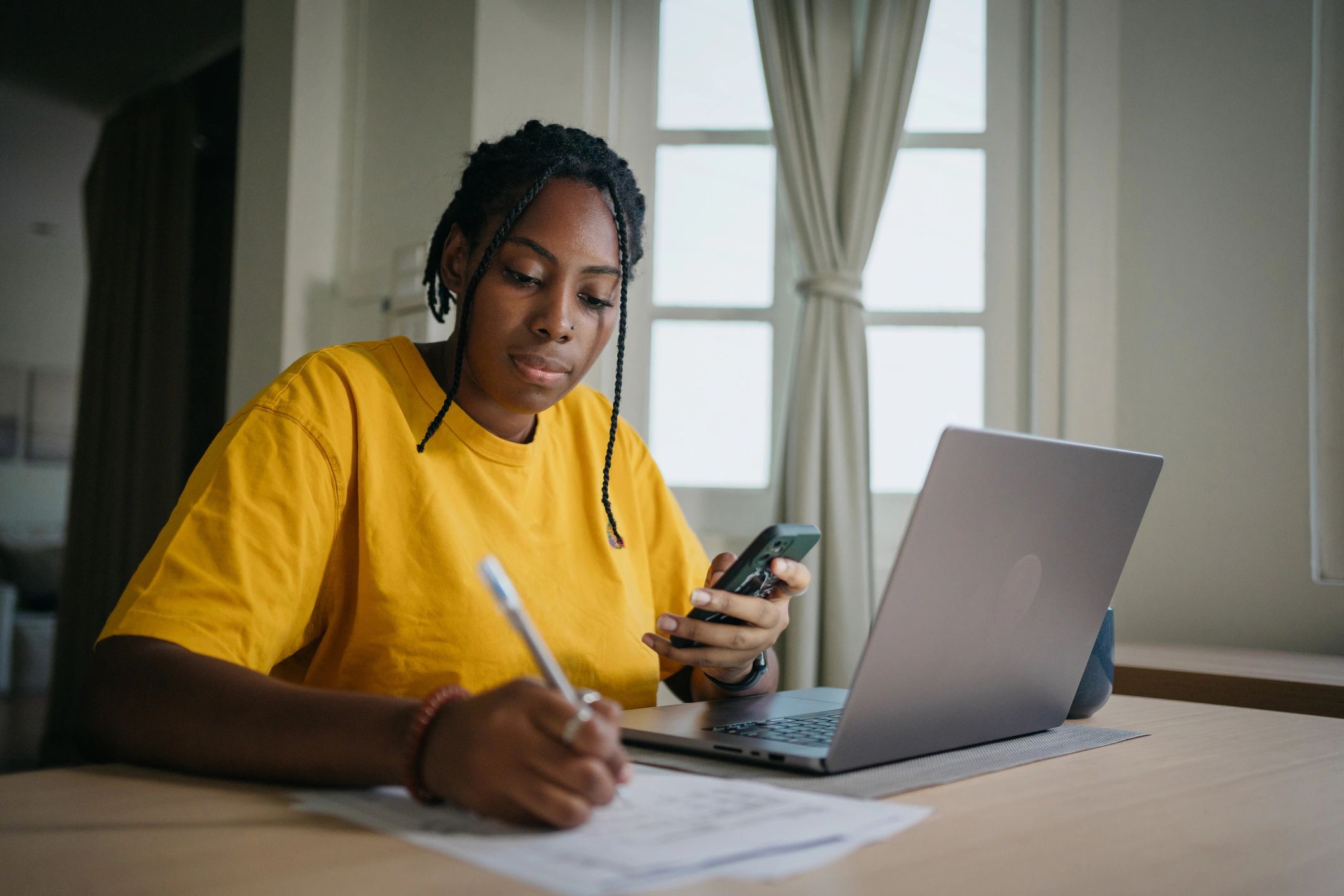 Student working on nursing writing at a laptop