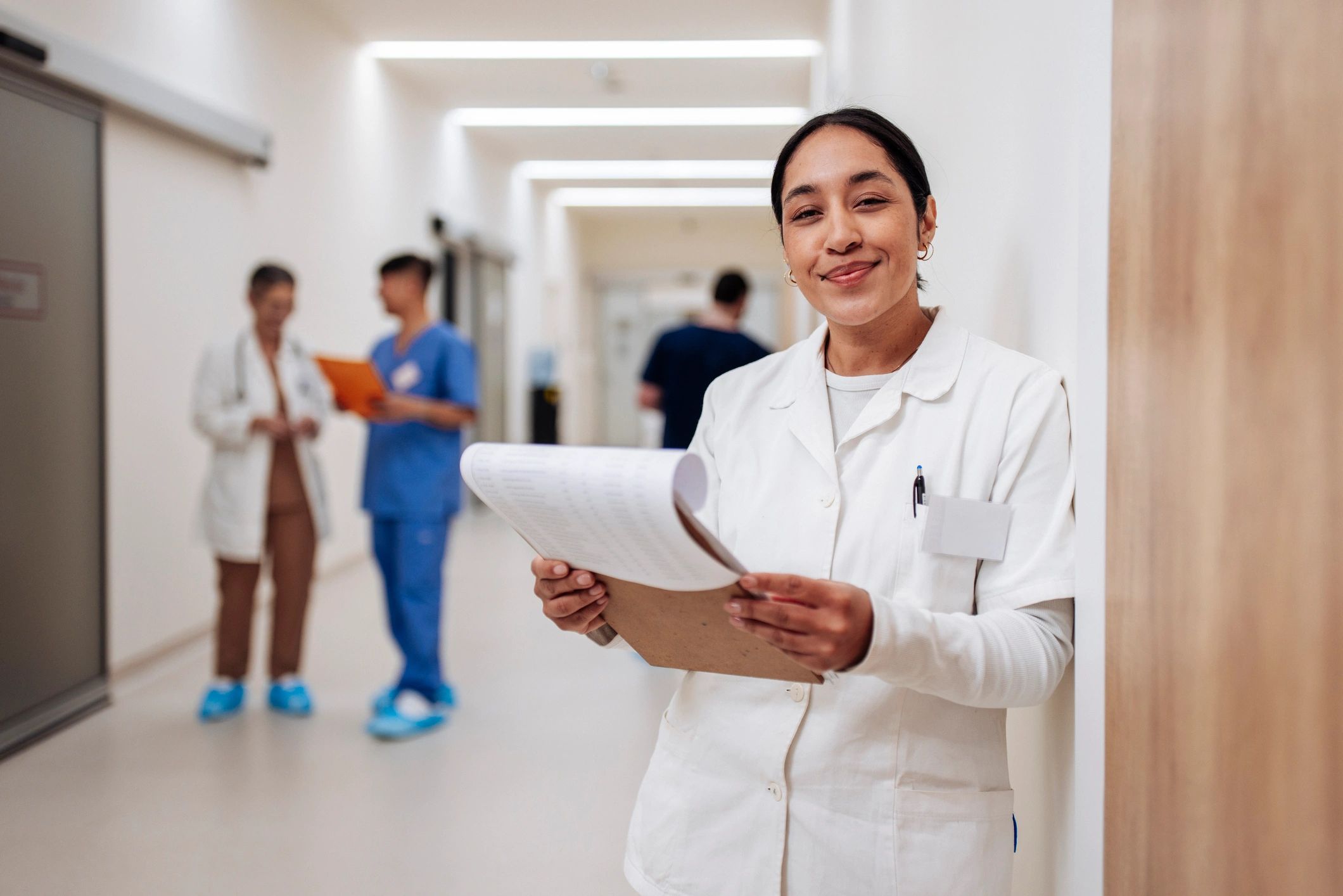 Healthcare professional holding documents