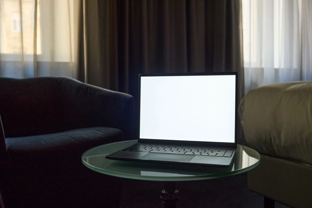 Laptop Displaying Blank Screen for Product Mockup in Home Office